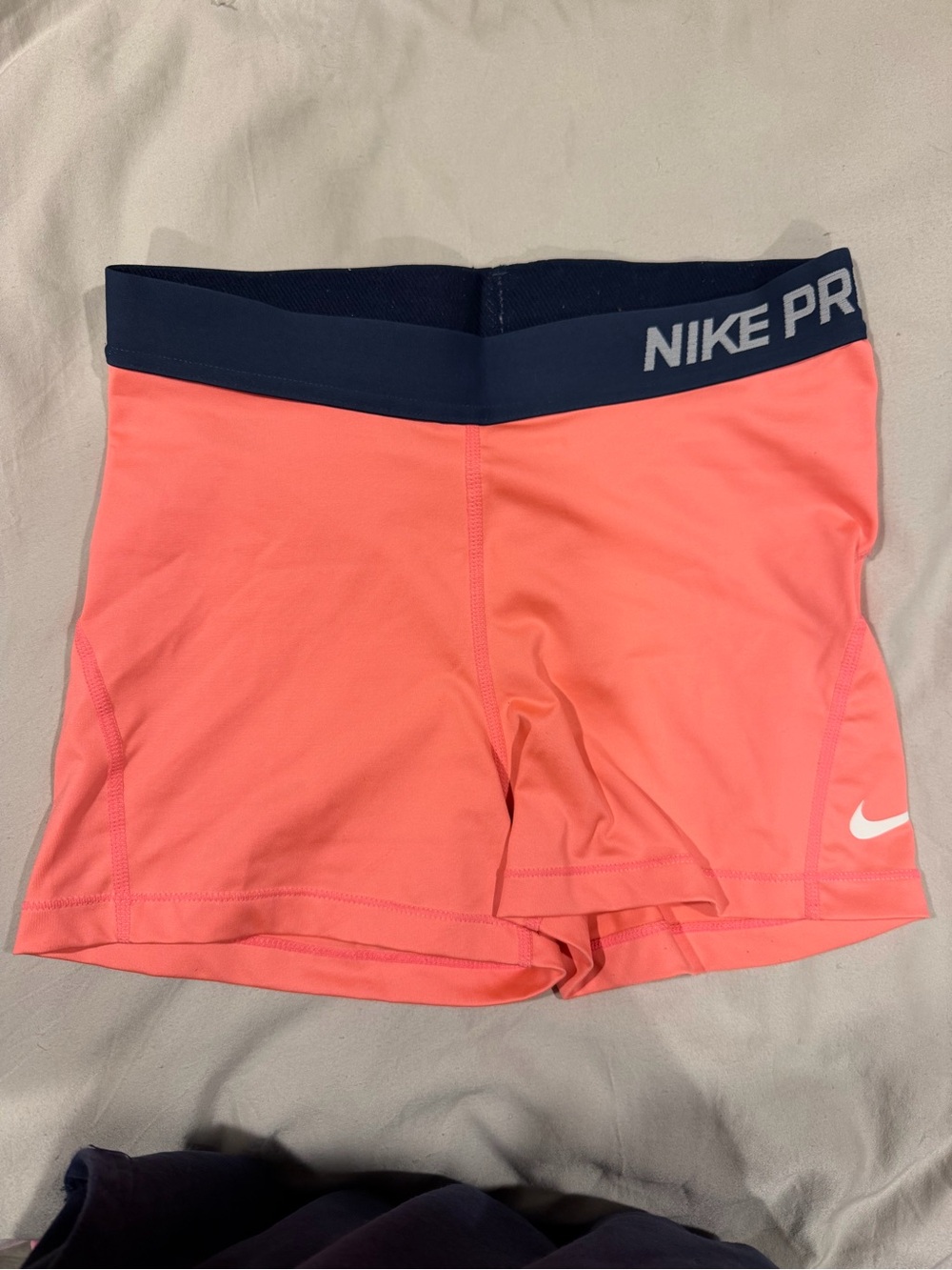 Nike Pro Women's Coral-Pink Athletic Shorts with Navy Waistband